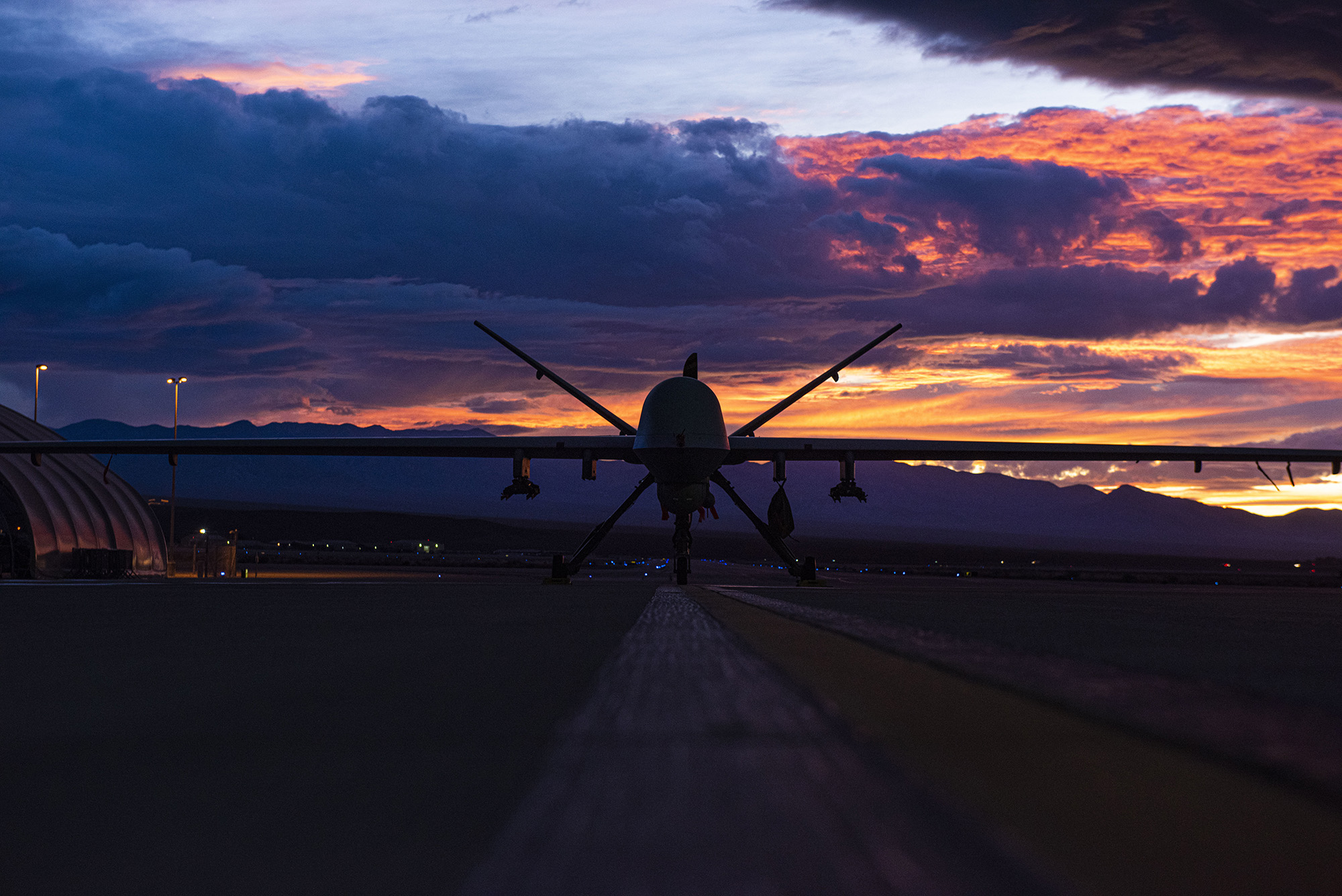 An MQ-9 Reaper sits on the flight line Nov. 20, 2019, as the sun sets at Creech Air Force Base, Nev. (Master Sgt. Dillon White/Air Force)