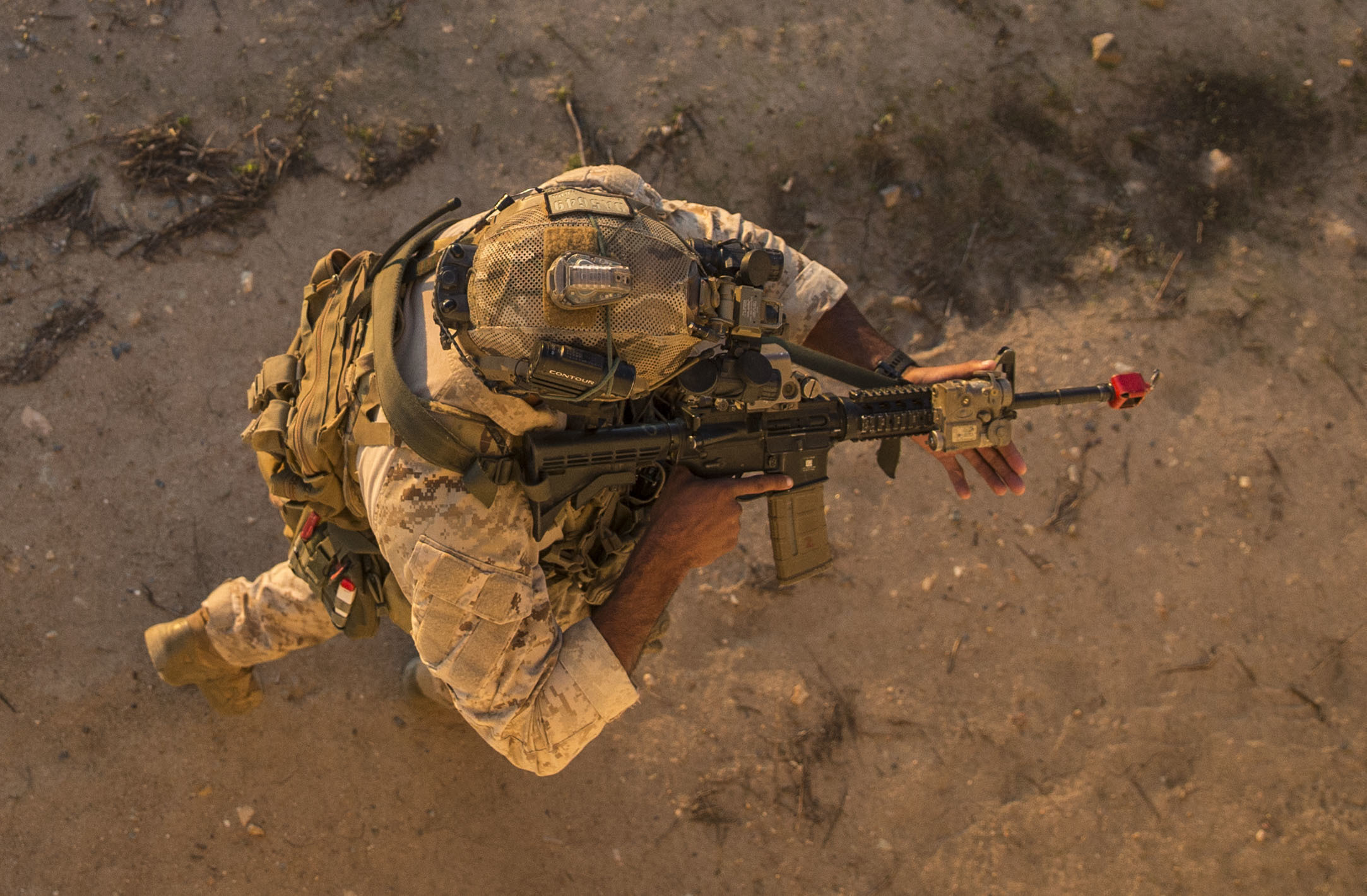 A Marine Raider conducts high-value target detainment and evacuation operations during a multipurpose canine handler training course hosted by 1st Marine Raider Battalion on Marine Corps Base Camp Pendleton, Calif,, Dec. 19, 2019. (Lance Cpl. Angela Wilcox/Marine Corps)