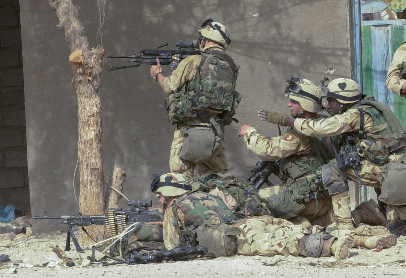 Soldiers from the 3rd Battalion, 2nd Brigade, 101st Airborne Division (Air Assault) engage in block-to-block urban combat in the streets of Karbala, Saturday, April 5. (Rob Curtis/Army Times)