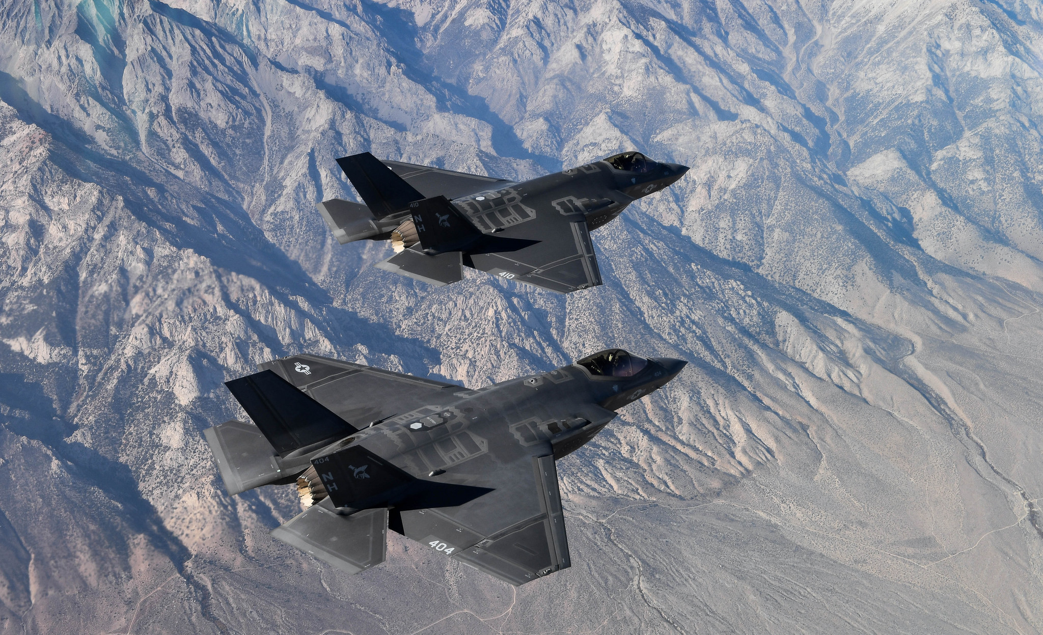 Two F-35C Lightning II aircraft attached to the Argonauts of Strike Fighter Squadron (VFA) 147, stationed at Naval Air Station Lemoore, fly in formation for a photo exercise over the California desert on Nov. 16, 2018. (Chief Mass Communication Specialist Shannon E. Renfroe/Navy)