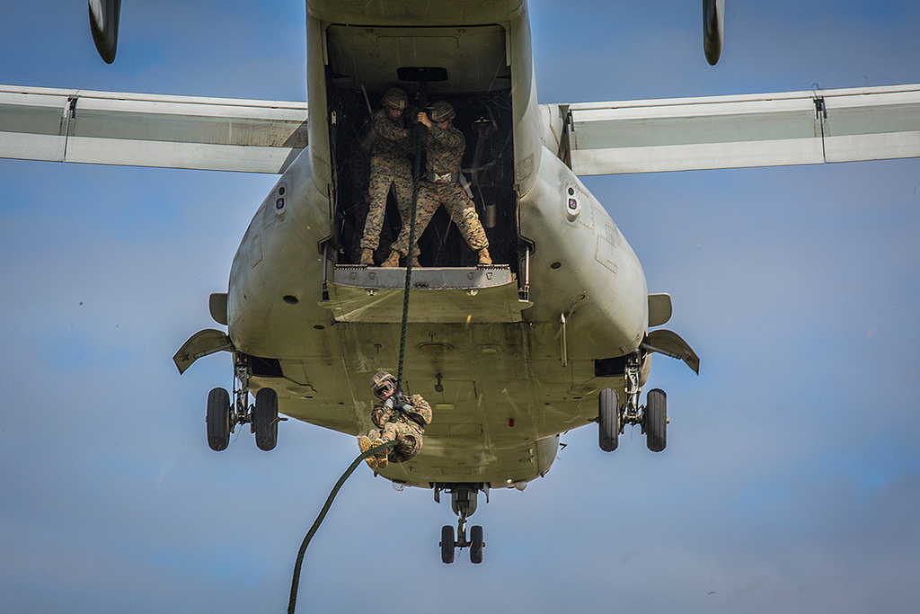 A Marine with 1st Battalion, 3rd Marine Regiment, attached to 3rd Marine Division, descends from an MV-22B Osprey on Nov. 28, 2017, at Camp Hansen, Okinawa. (Lance Cpl. Andy Martinez/Marine Corps)
