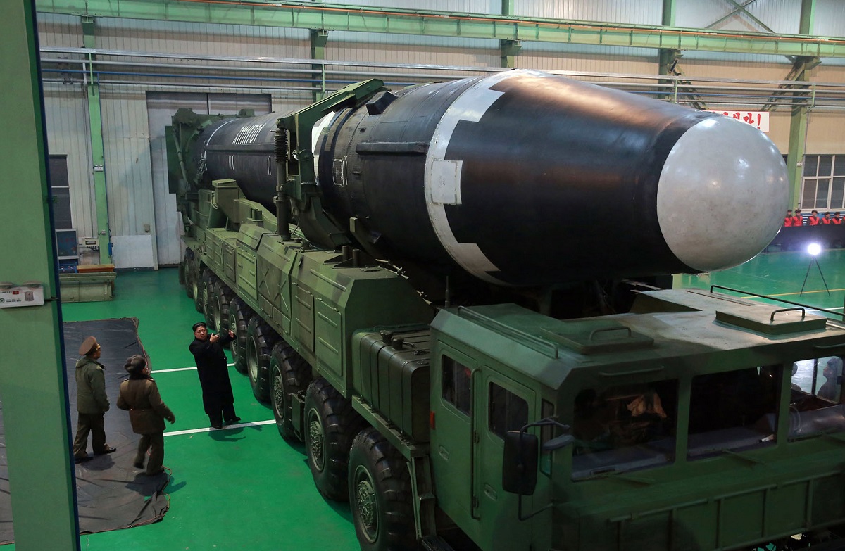 North Korean leader Kim Jong Un, right, stands next to the Hwasong-15 ICBM in North Korea. North Korea's last missile test of 2017 featured its largest missile to date, the Hwasong-15, on Nov. 28. North Korean leaders released a statement after the test, claiming the missile was “capable of carrying a super-heavy nuclear warhead.” (Korean Central News Agency/Korea News Service via AP)