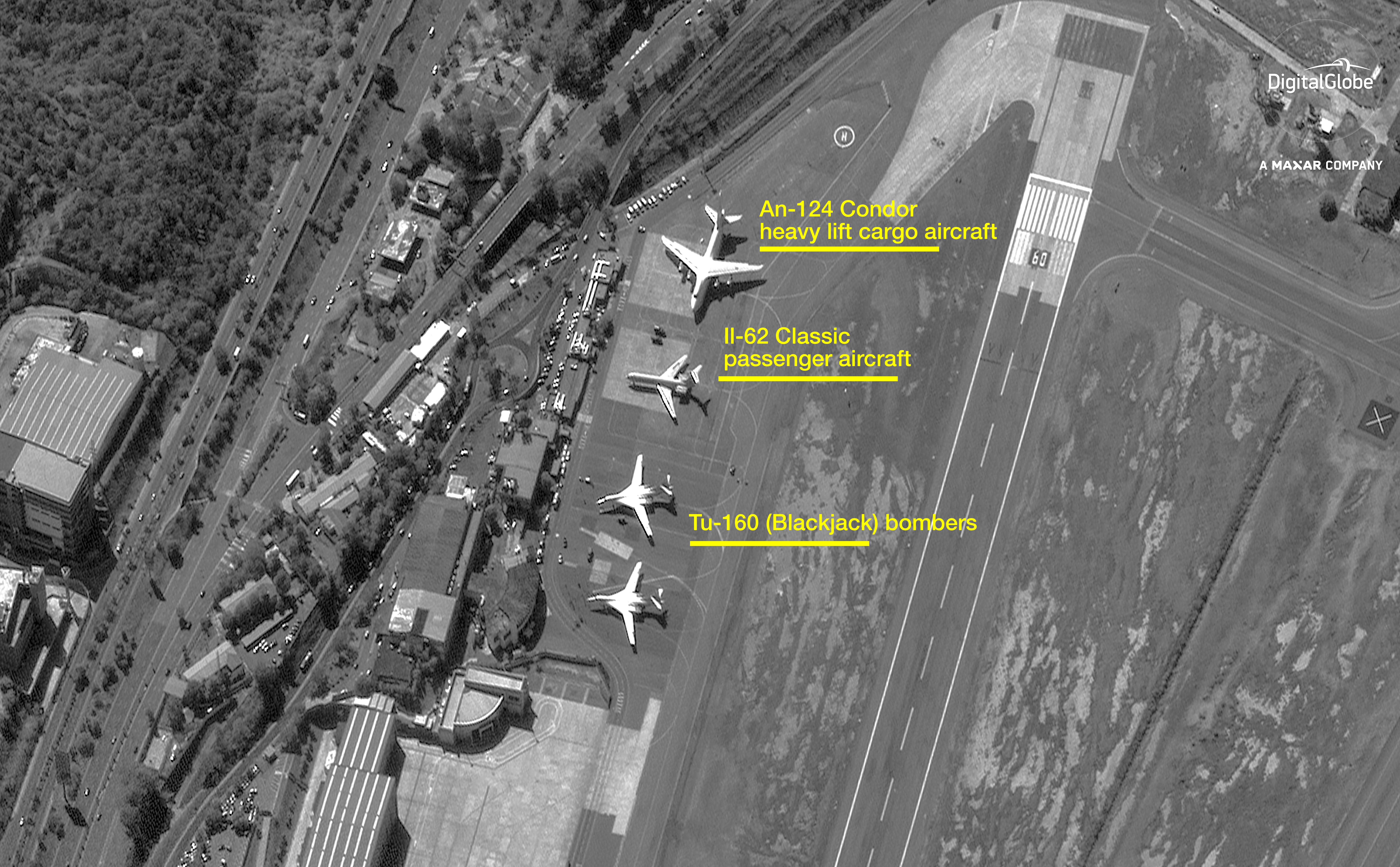 Satellite photos provided by DigitalGlobe show two Russian nuclear-capable Tu-160 Blackjack bombers along with a heavy-lift AN-124 cargo plane and an Il-62 passenger plane outside of Venezuela's capital on Dec. 10, 2018. (DigitalGlobe)
