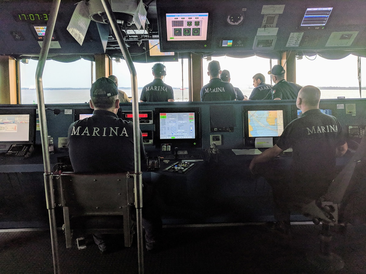The helmsman, left, and navigator, right, guide the Alpino into Baltimore Harbor after a transit up the Chesapeake Bay. (David B. Larter/Staff)