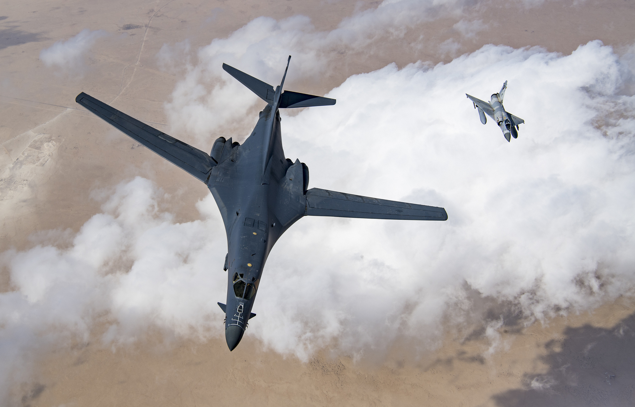 A U.S. Air Force B-1B Lancer bomber and a Qatari Mirage 2000 fly in formation, Feb. 19, 2019. (Staff Sgt. Clayton Cupit/Air Force)