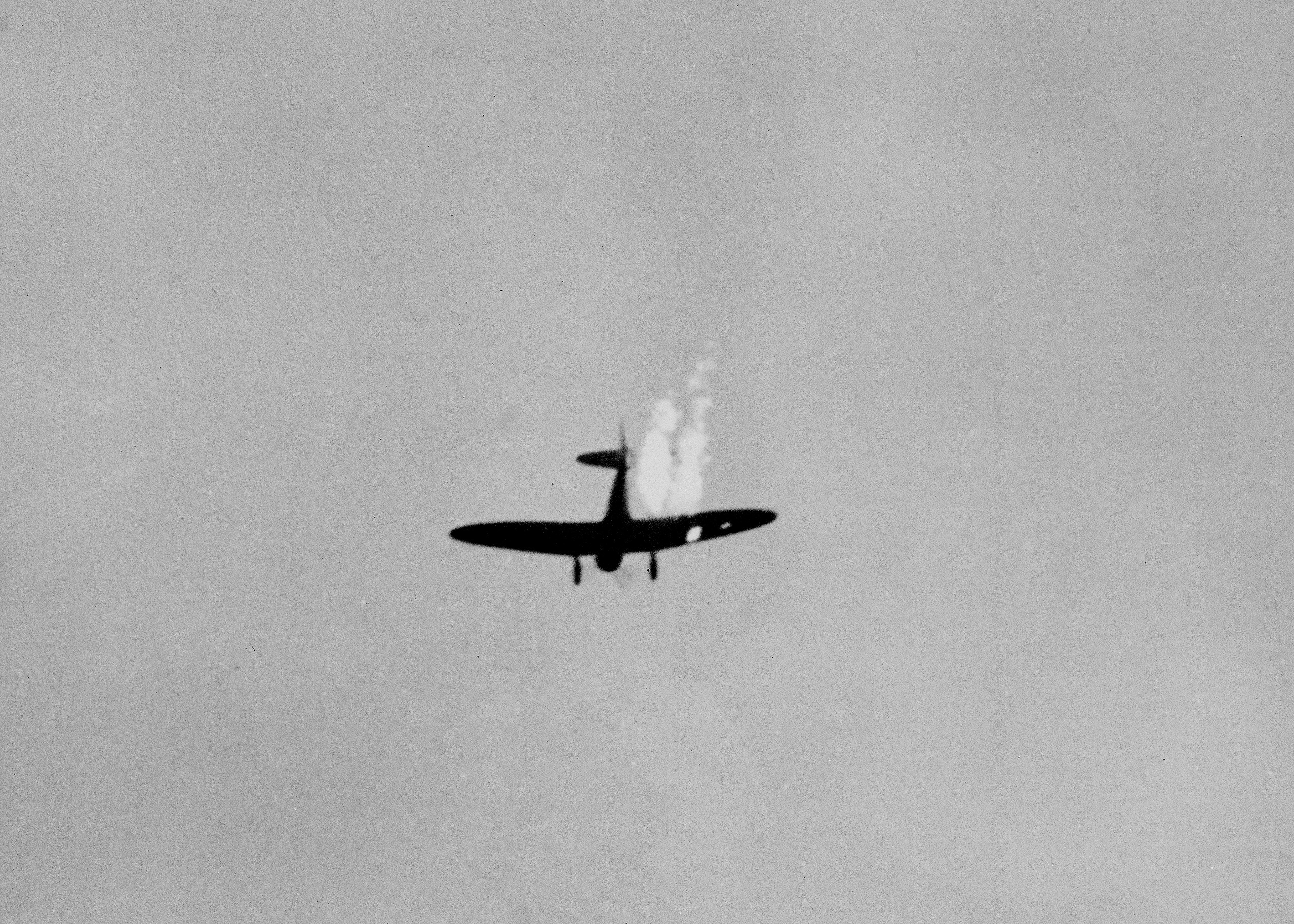 A Japanese dive bomber goes into its last dive as it heads toward the ground in flames after it was hit by Naval anti-aircraft fire during surprise attack on Pearl Harbor, Dec. 7, 1941. (AP Photo)