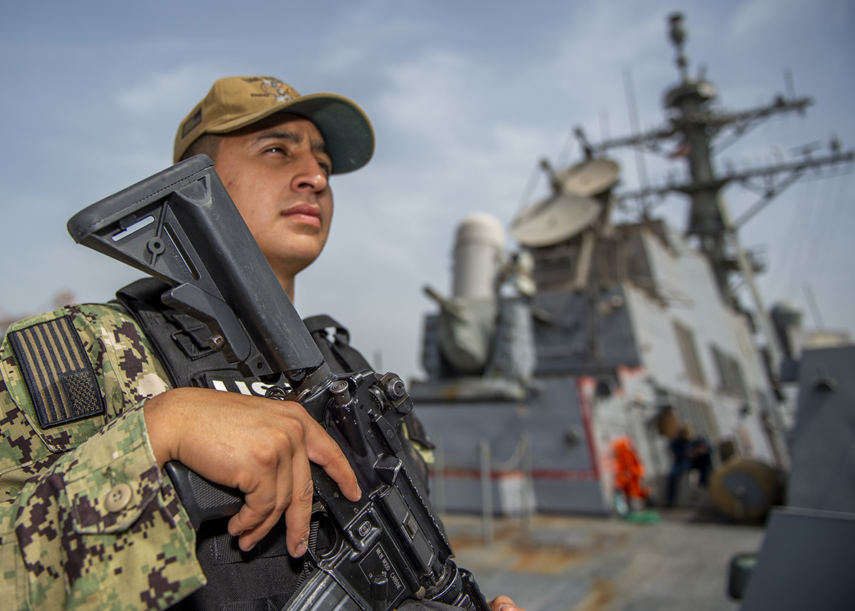 Seaman Christian Ramirez stands watch aboard the Arleigh Burke-class guided-missile destroyer USS Bainbridge (DDG 96) on April 26, 2019 in Taranto, Italy. (Mass Communication Specialist Seaman Jason Waite/Navy)
