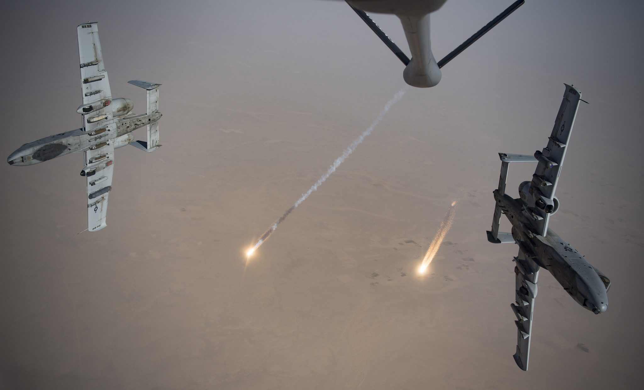 U.S. Air Force A-10 Thunderbolt IIs fire flares while breaking away after aerial refueling from a KC-135 Stratotanker out of Kandahar Airfield, Afghanistan, Aug. 15, 2019. (Staff Sgt. Keifer Bowes/Air Force)