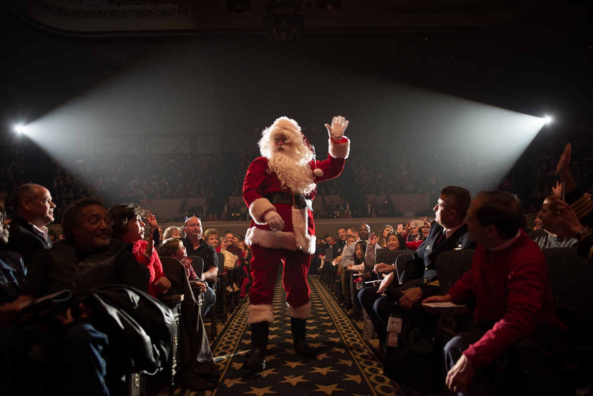 Senior Chief Musician William P. Gray (AKA Santa) visits with the U.S. Navy Band during a holiday concert Dec. 16, 2017, at DAR Constitution Hall in Washington. The Navy Band hosted thousands of people from the Washington area as well as hundreds of senior Navy and government officials during its three annual holiday concerts. (Musician 1st Class David Aspinwall/Navy)