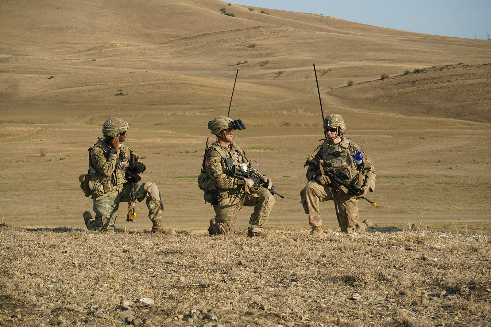 Three soldiers prepare to begin a live-fire exercise near Tbilisi, Georgia, Aug. 4, 2019. (Sgt. LaShic Patterson/Army)