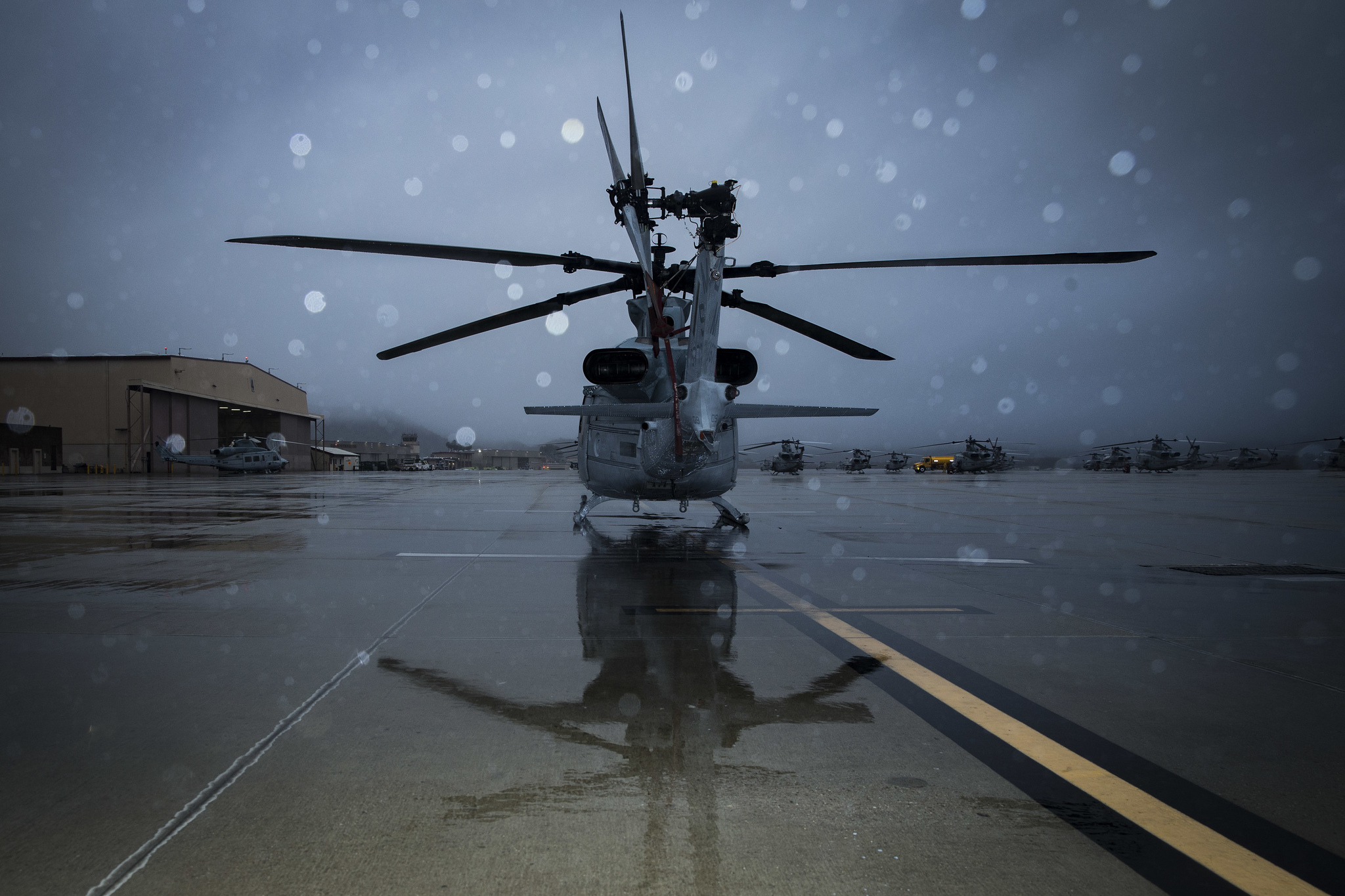 Rain drenches a UH-1Y Venom helicopter on the flight line at Marine Corps Air Station Camp Pendleton, Calif., Jan. 16, 2019. (Lance Cpl. Drake Nickels/Marine Corps)