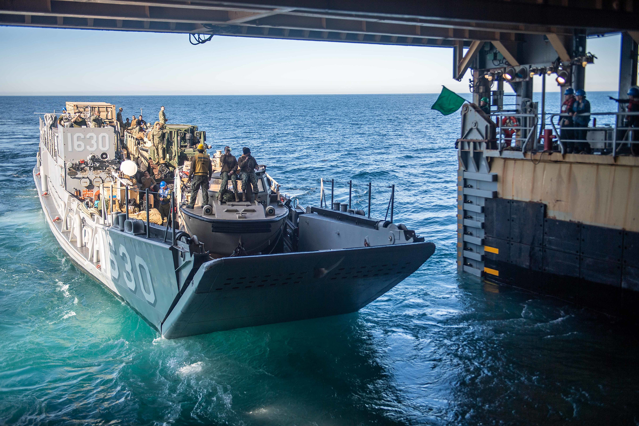 191124-N-HD110-1039\r\rPACIFIC OCEAN (Nov. 24, 2019) Landing Craft, Utility 1630, attached to Assault Craft Unit (ACU) 1, exits the well deck of the amphibious dock landing ship USS Harpers Ferry (LSD 49). Sailors and Marines of the Boxer Amphibious Ready Group (ARG) and the 11th Marine Expeditionary Unit (MEU) are embarked on Harpers Ferry for a regularly-scheduled deployment. (U.S. Navy photo by Mass Communication Specialist 3rd Class Danielle A. Baker)