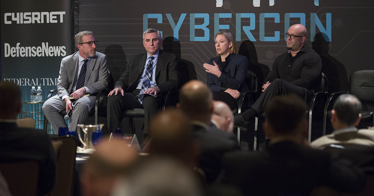 Mike Gruss, left, editor of C4ISRNET moderates a panel discussion on the New Critical Infrastructure with Maj. Gen. John Davis, USA (ret.), Vice President and Federal Chief Security Officer, Palo Alto Networks and former Deputy Assistant Secretary of Defense for Cyber Policy (Acting), Jeanette Manfra Assistant Secretary, Office of Cybersecurity and Communications, and James Scott, Senior Fellow, ICIT, during Cybercon 2017 at the Ritz-Carlton Hotel in Pentagon City on Nov. 28, 2017. ( Ben Murray/Staff)