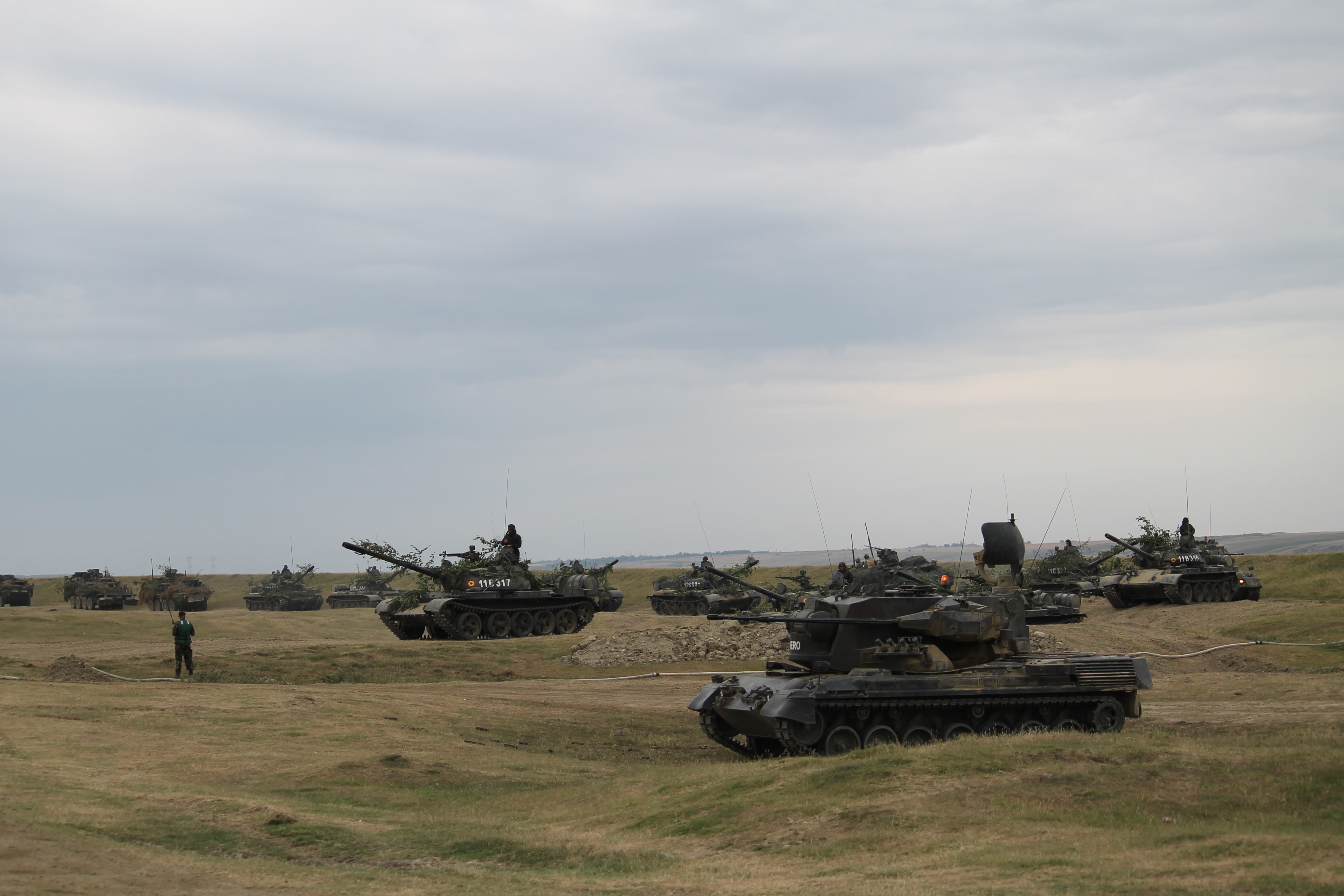 A Gepard in the foreground continues to scan the skies for threats while Romanian tanks and U.S. Strykers begin to line up on the beach in order to cross the bridge. (Jen Judson/Staff)