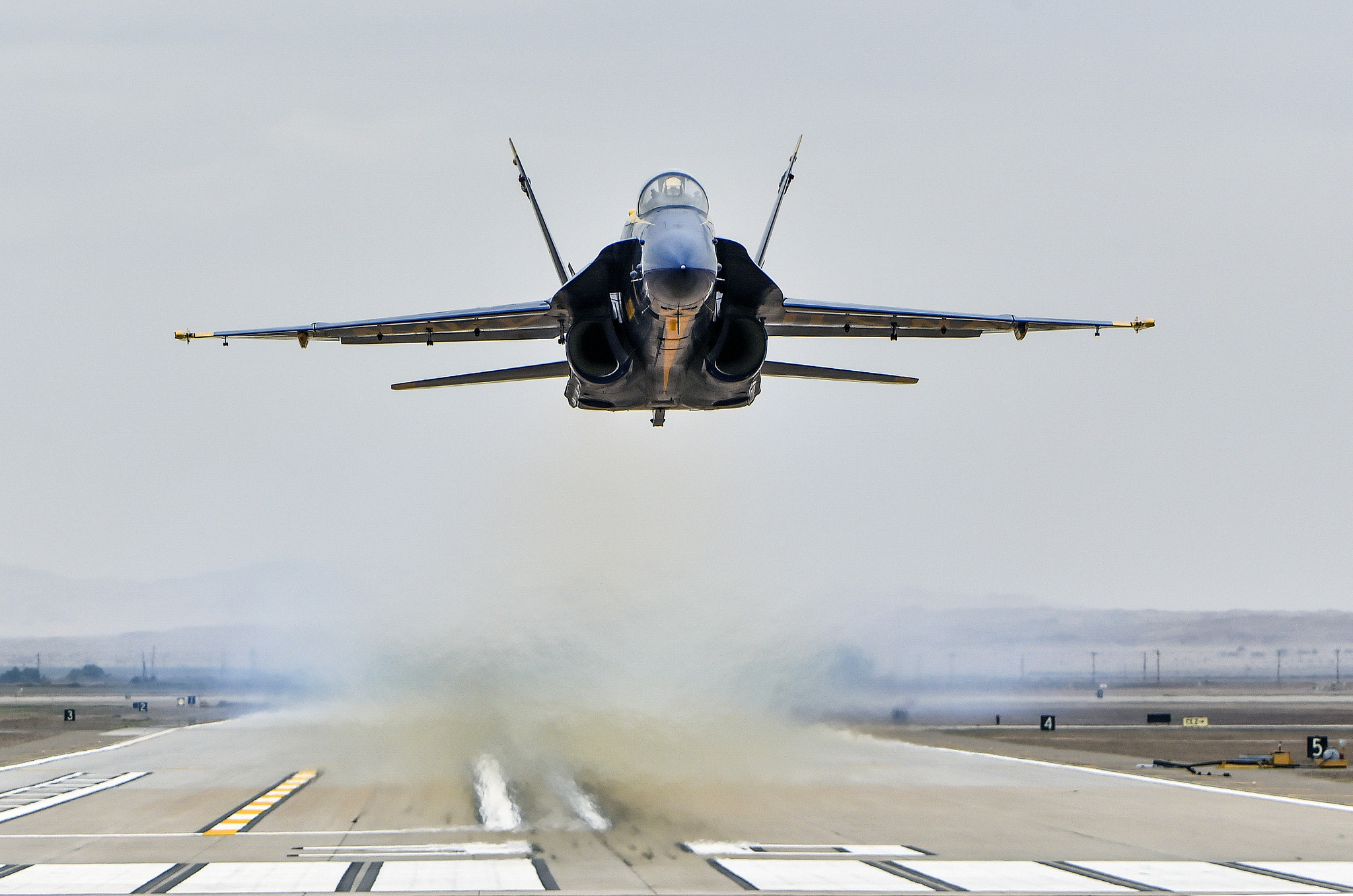 Opposing solo pilot Lt. Cmdr. Andre Webb, assigned to the U.S. Navy Flight Demonstration Squadron, the Blue Angels, performs a low transition take off during a practice demonstration on Feb. 2, 2019, at Naval Air Facility El Centro, Calif. (Mass Communication Specialist 2nd Class Timothy Schumaker/Navy)