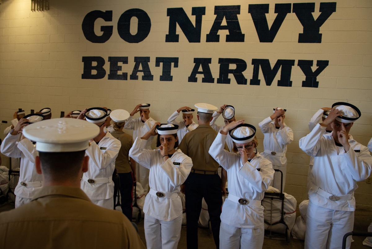 Plebes with the Class of 2023 don their covers at Induction Day on June 27, 2019, at the U.S. Naval Academy in Annapolis, Md. (U.S. Naval Academy)