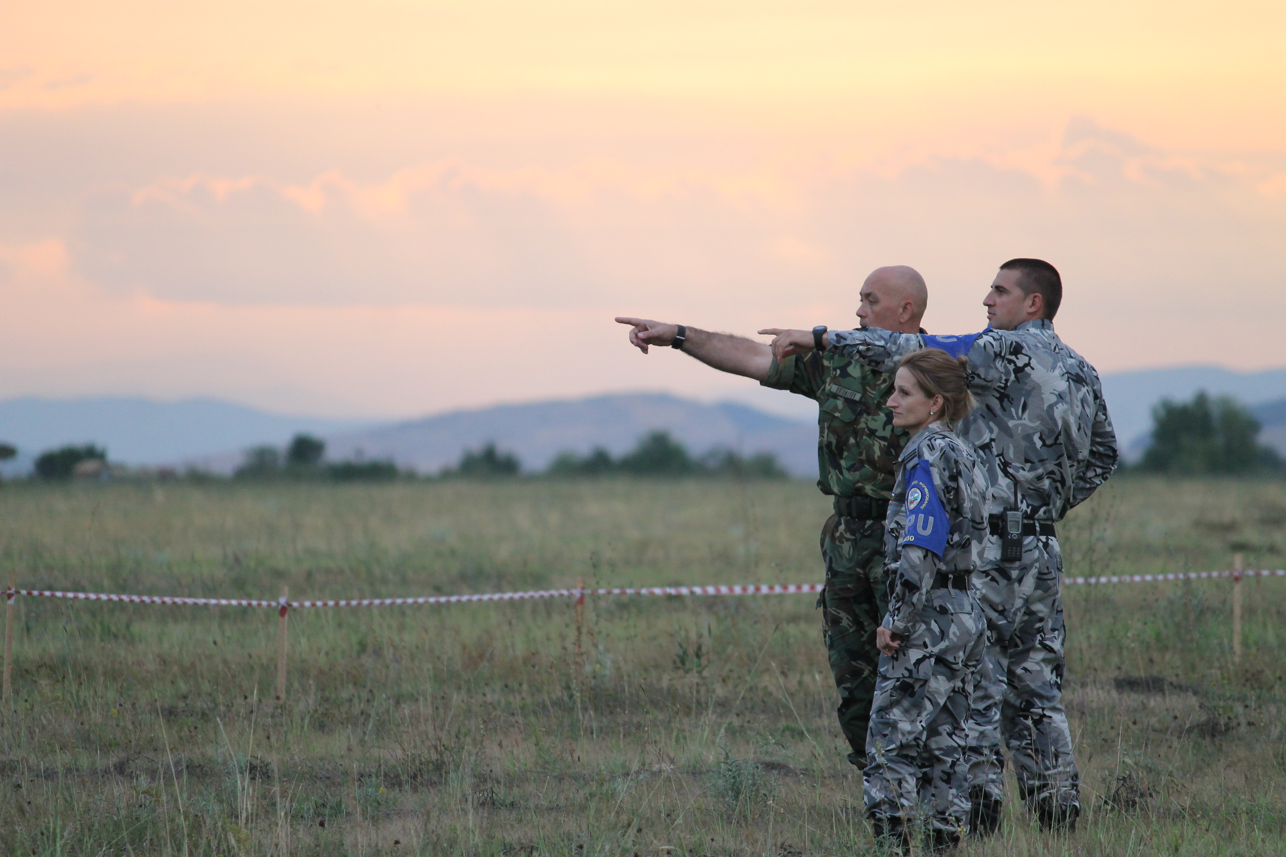 Bulgarian soldiers watch as paratroopers drop into the landing zone at sunset. Bulgaria was the lead host of the annual Saber Guardian exercise, which is a U.S. Army-led event that incorporates military activities in Hungary, Bulgaria and Romania. (Jen Judson/Staff)