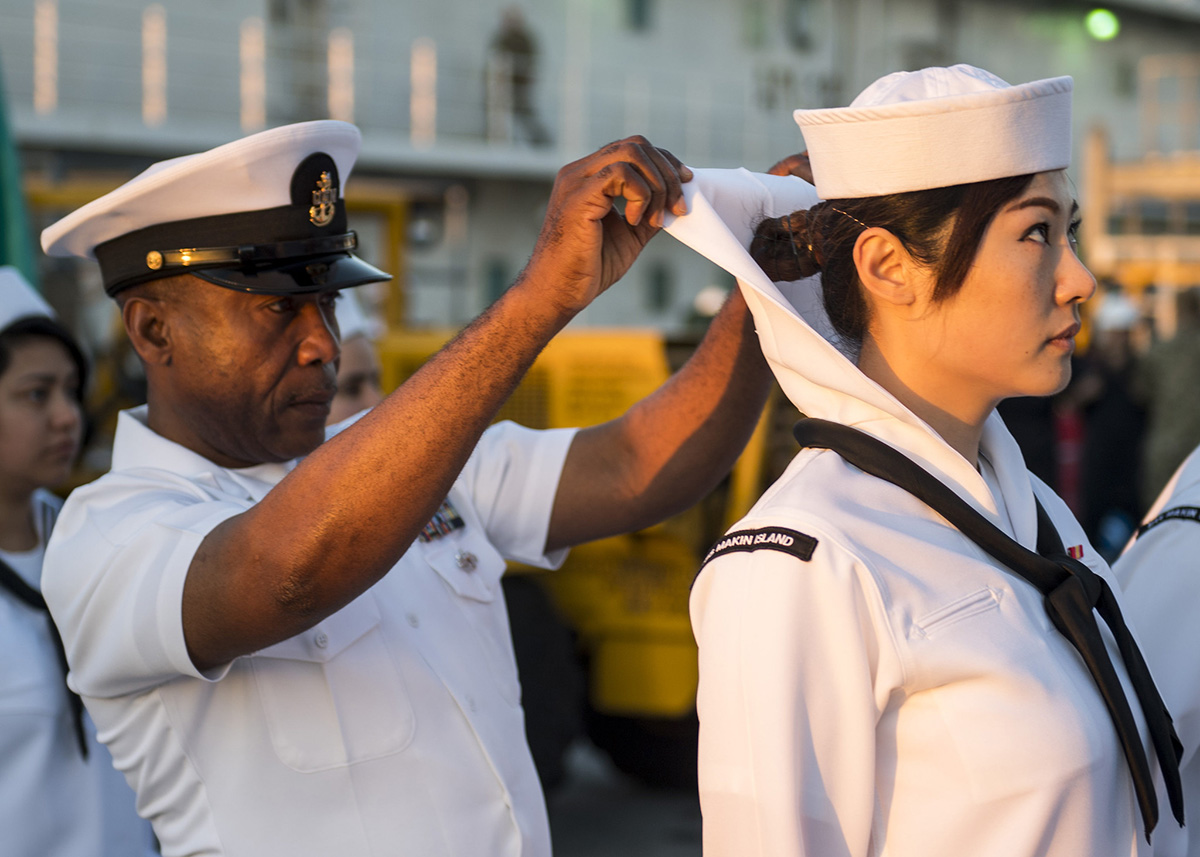 Senior Chief Aviation Support Equipment Technician Augustine Ilomuanya conducts a dress white uniform inspection on March 22, 2019, aboard the amphibious assault ship USS Makin Island (LHD 8). (Mass Communication Specialist 2nd Class Colby A. Mothershead//Navy)