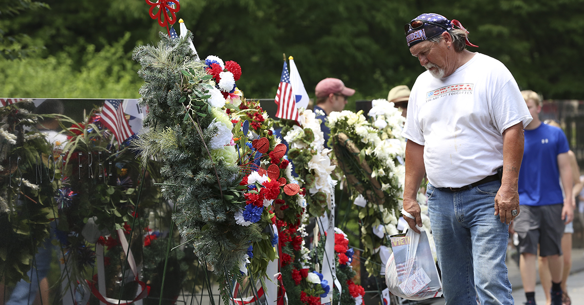 An onlooker looks at wreaths in the Korean War Memorial on Sunday, May 27 in Washington, D.C. during Memorial Day Weekend festivities throughout the city. (Ben Murray / Military Times)