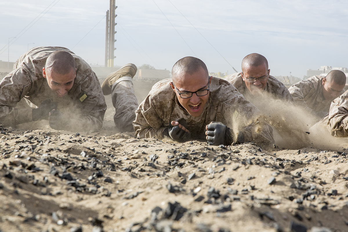 Recruits with Hotel Company, 2nd Recruit Training Battalion, crawl during a combat conditioning exercise at Marine Corps Recruit Depot San Diego on Nov. 14, 2018. (Marine Corps)