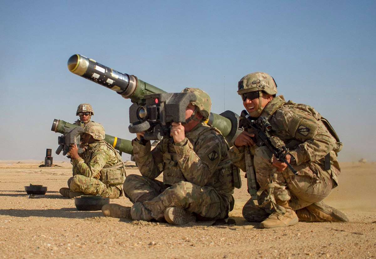Army Pvt. Hayden Johnson, center, fires a Javelin shoulder-fired anti-tank missile during a combined arms live fire exercise as part of Desert Observer II the Udairi Range Complex near Camp Buehring, Kuwait, Dec. 12, 2018. (Spc. Jovi Prevot/Army National Guard)
