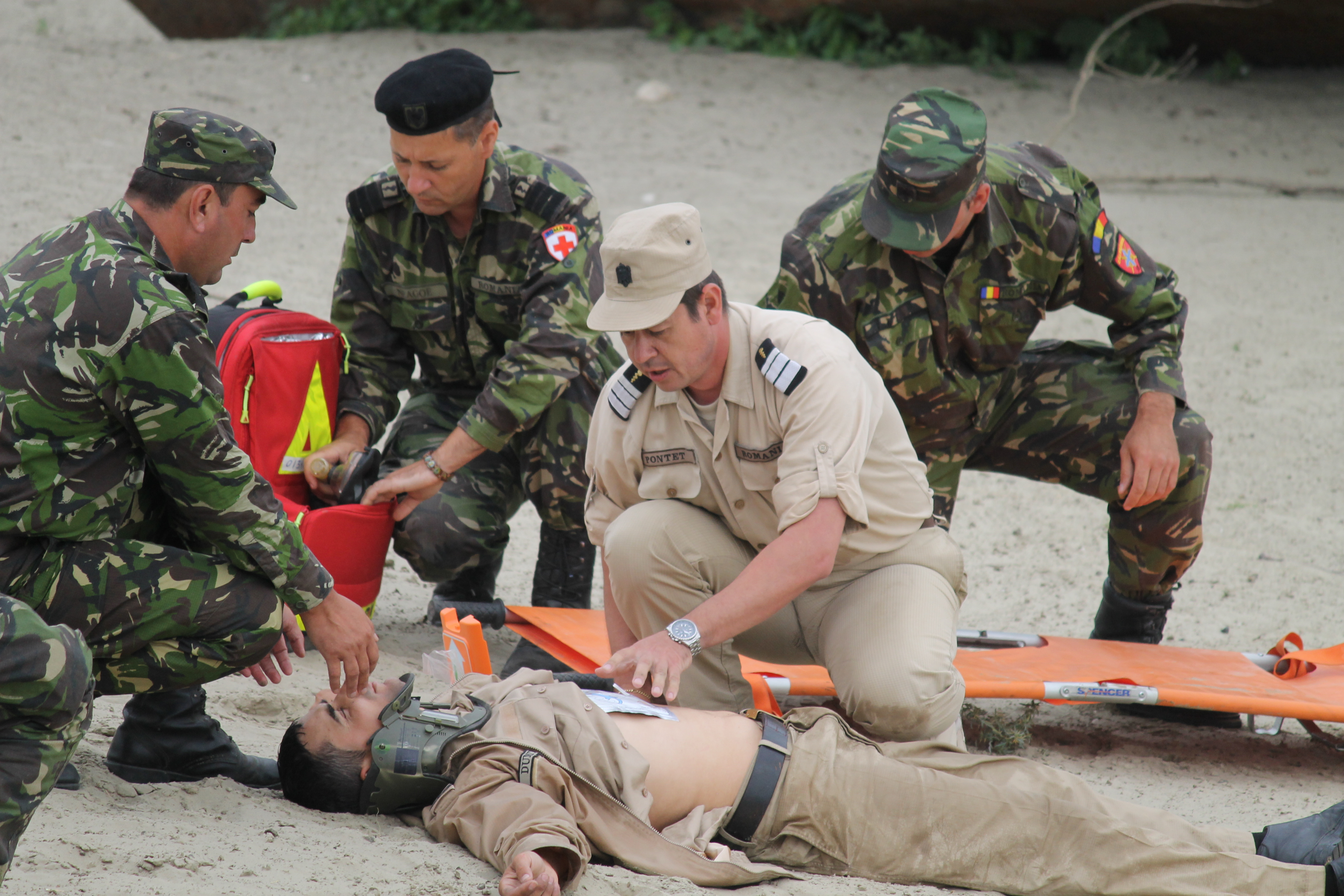 Romanian medics practice responding to an injured sailor from one of the navy ships in the river. A raft rescued the sailor, simulating an injury and brought him to shore, where he was treated and whisked away in a medical vehicle. The river crossing exercise also simulated a mass casualty event and corresponded with a mass casualty exercise at nearby Mihail Kogalniceanu Air Base, where the personnel feigned injuries to allow military medics from Romania, the U.S. and the Balkan Medical Task Force to practice high-level triage skills. (Jen Judson/Staff)