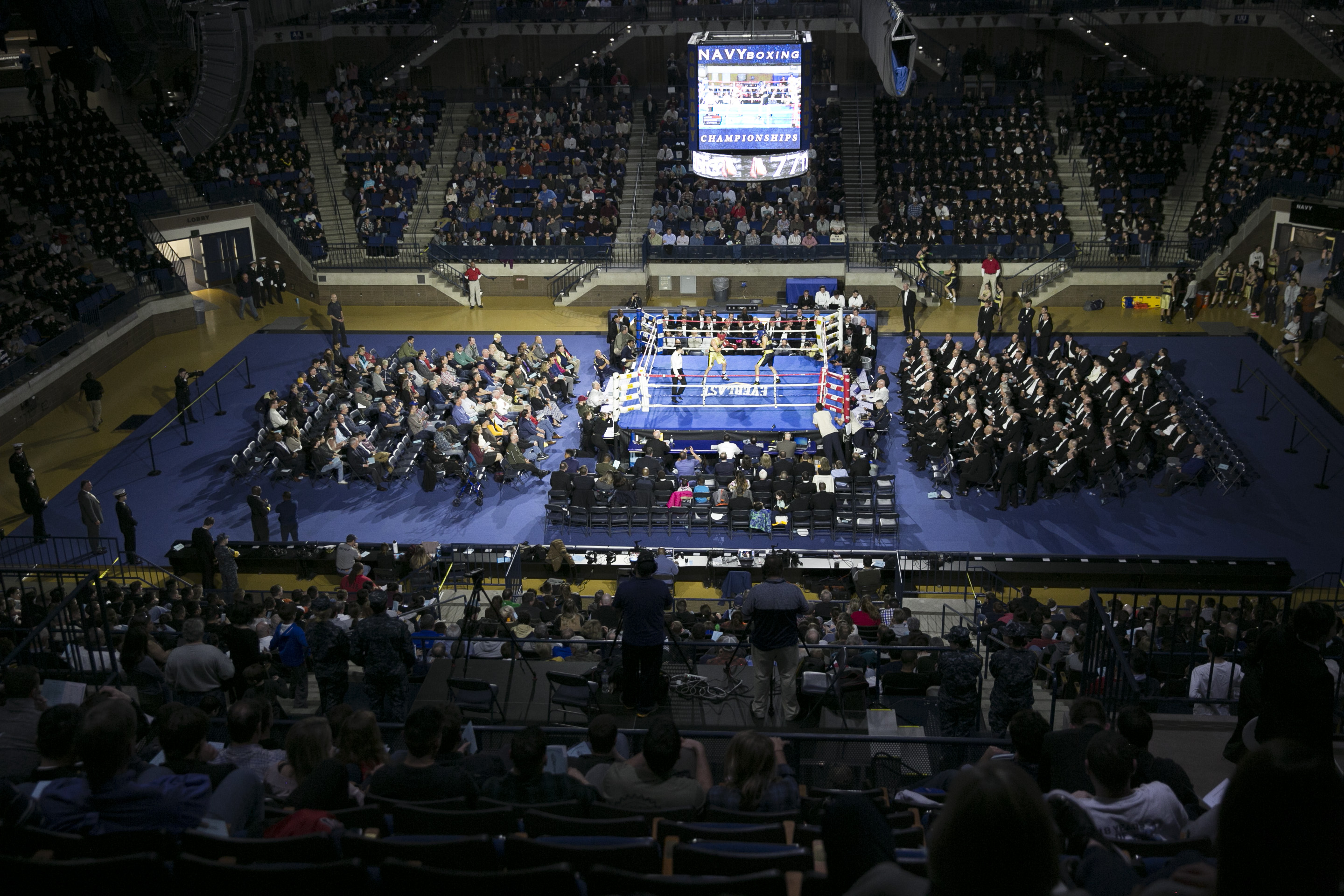 /Alex Olajide (in gold) from New York, fights Ryan Caldwell (in Blue) from Valley Forge, PA, in the 165 lb fight during the United States Naval Academy's 77th Brigade Boxing Championships held on Feb. 23, 2018. (Alan Lessig/Staff)