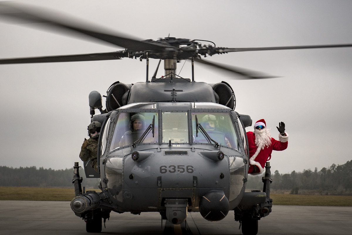 Santa poses with the crew of an HH-60G Pave Hawk from the 41st Rescue Squadron, Dec. 9, 2017, on the flightline at Moody Air Force Base, Ga. (Staff Sgt. Ryan Callaghan/Air Force)