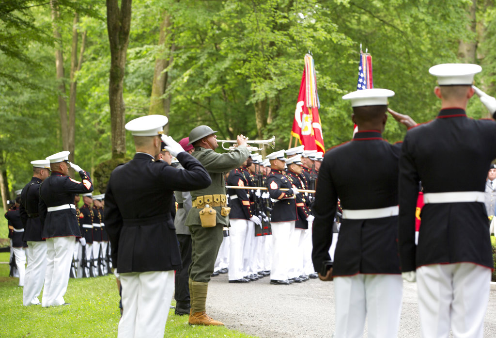 U.S. Marines salute as they participate in a commemoration at the American Marine Memorial in Belleau Wood prior to a service at the Aisne-Marne American Cemetery in Belleau, France, Sunday, May 27, 2018. (Virginia Mayo/AP)