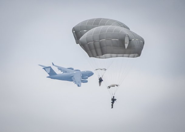 Army paratroopers and eight partner NATO nations conduct airborne operations at Sicily Drop Zone during the 20th Annual Randy Oler Memorial Operation Toy Drop, Dec. 2, 2017. Operation Toy Drop, hosted by the U.S. Army Civil Affairs & Psychological Operations Command (Airborne) and is the largest combined airborne operation conducted worldwide. (Staff Sgt. Timothy R. Koster/Army)