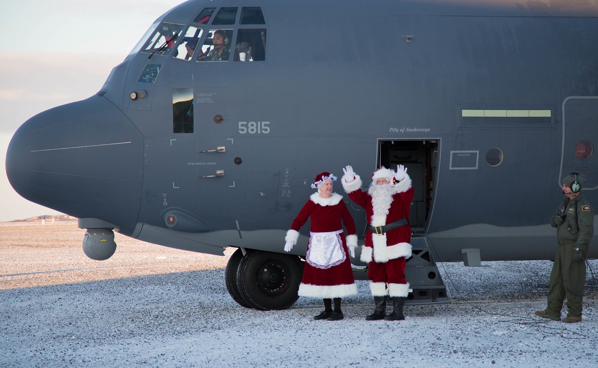 Mr. and Mrs. Santa Claus, travelling with Operation Santa Claus, de-board an HC-130J Combat King II from the 211th Rescue Squadron, Alaska Air National Guard, after landing in St. Michael, Alaska, on Dec. 5, 2017. Operation Santa Claus is an Alaska National Guard annual community outreach program that provides Christmas gifts, books, backpacks filled with school supplies, fresh fruit and sundaes to youngsters in rural communities. (2nd Lt. Marisa Lindsay/Army National Guard)