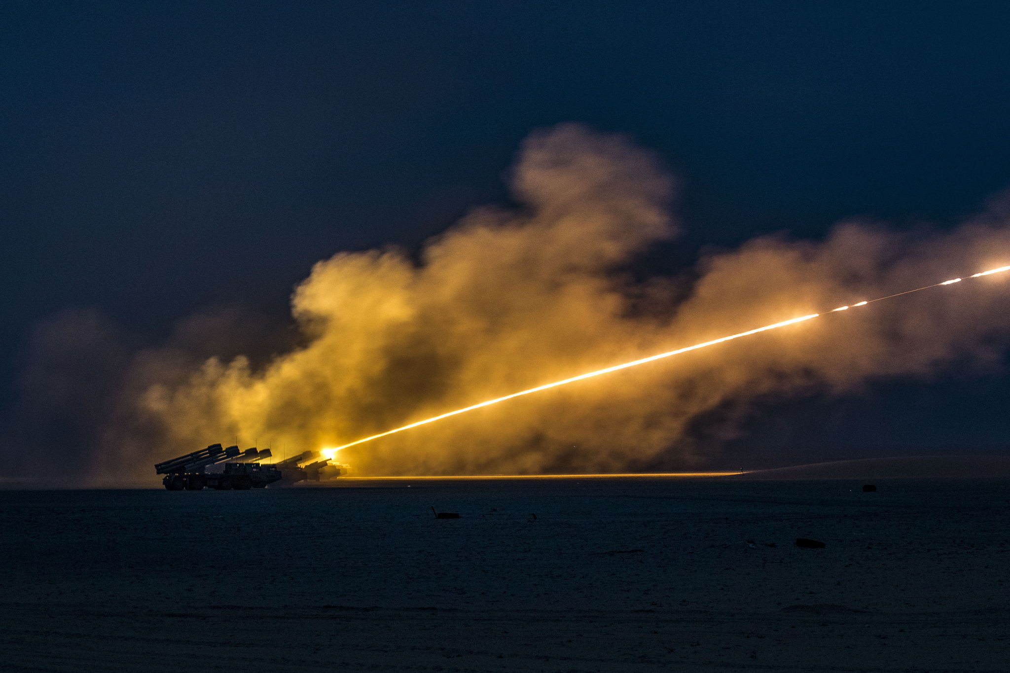 U.S. soldiers and soldiers with the Kuwait Land Forces fire their High Mobility Artillery Rocket Systems (U.S.) and BM-30 Smerch rocket systems (Kuwait) during a joint live-fire exercise on Jan. 8, 2019, near Camp Buehring, Kuwait. (Sgt. James Lefty Larimer/Army)