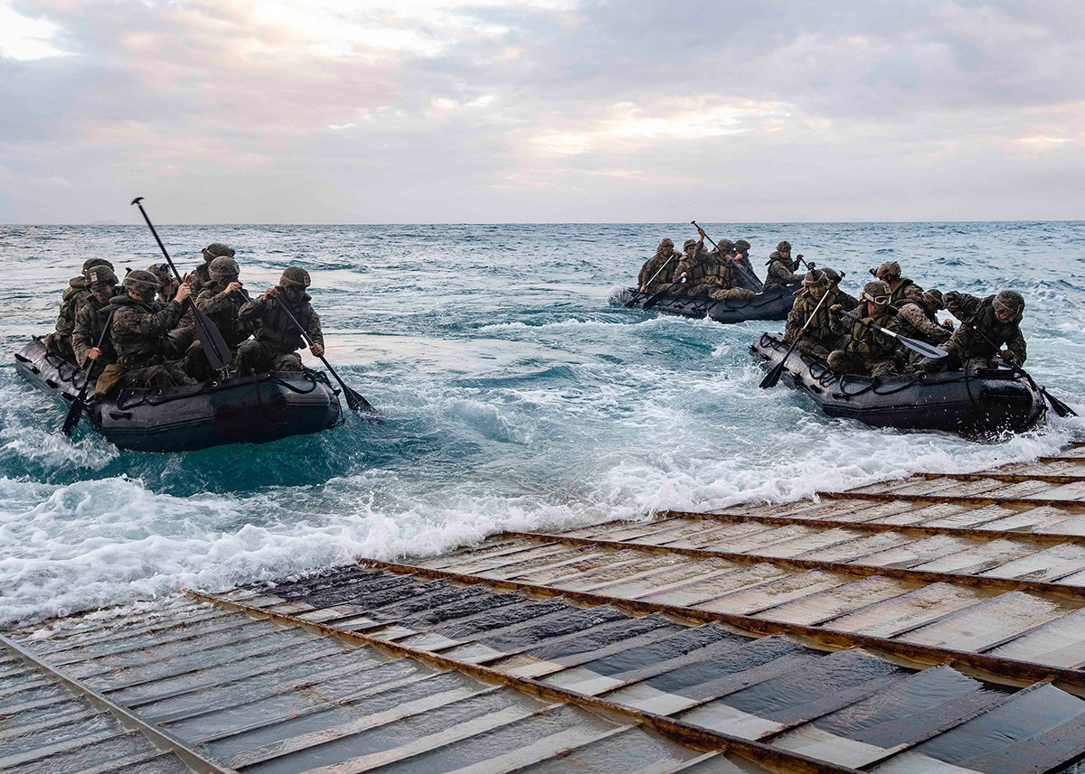 Marines launch in combat rubber raiding crafts from the stern gate of the amphibious dock landing ship USS Ashland (LSD 48) on July 3, 2019, in the Coral Sea. (Mass Communication Specialist 2nd Class Markus Castaneda/Navy)