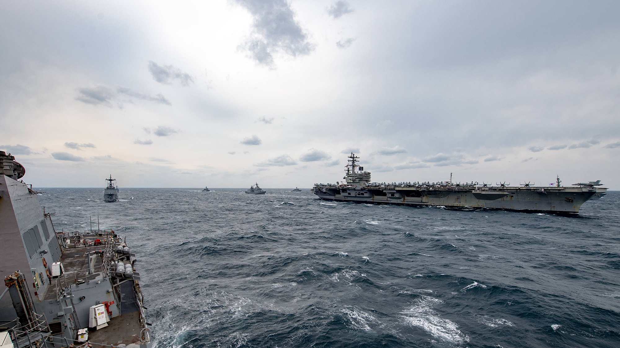 The forward-deployed Arleigh Burke-class guided-missile destroyer USS Stethem (DDG 63) joins Republic of Korea Navy ships for an exercise with the aircraft Carrier USS Ronald Reagan (CVN 76). Stethem is on patrol in the U.S. 7th Fleet area of operations in support of security and stability in the Indo-Asia Pacific region. (Specialist 2nd Class Jeremy Graham/Navy)