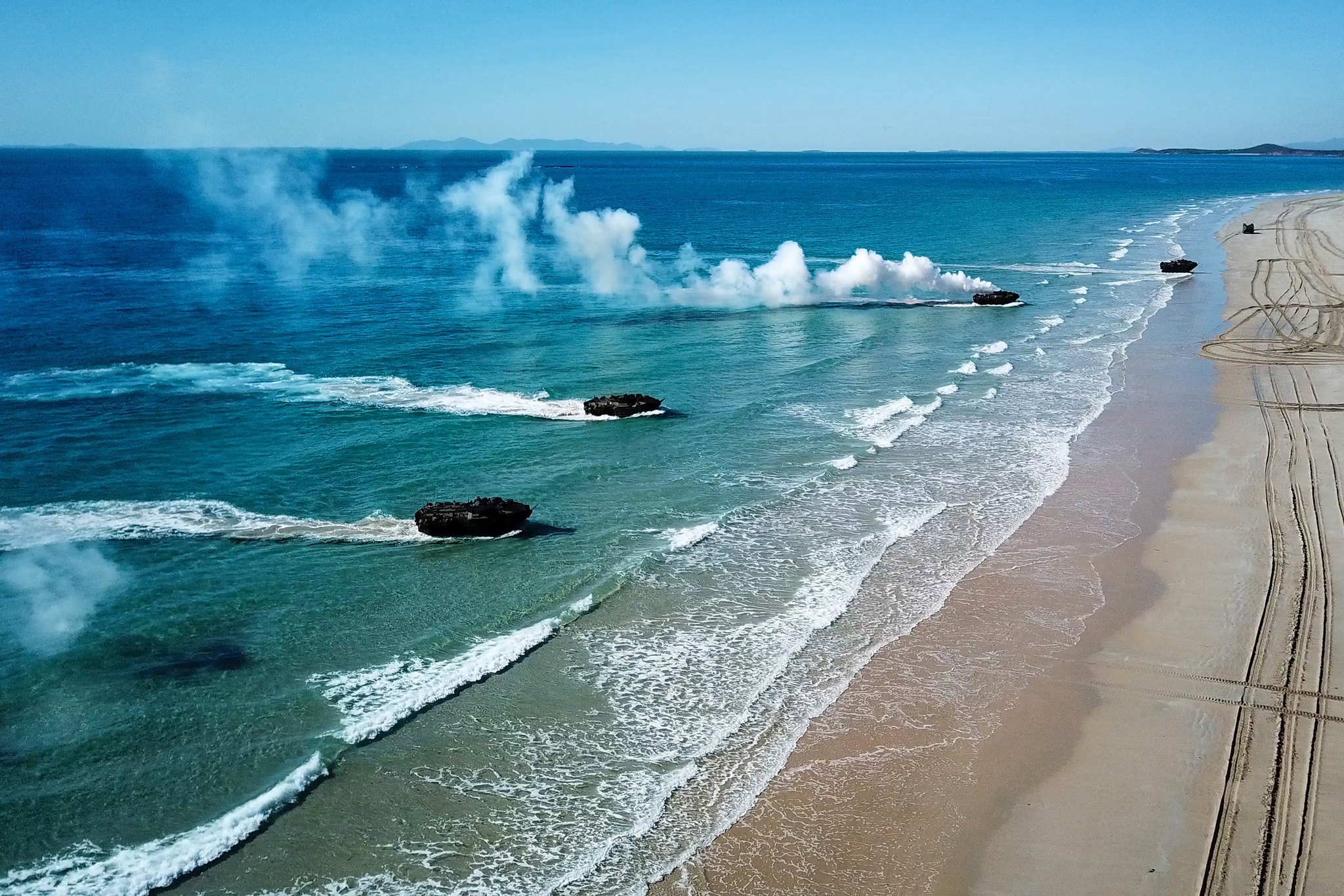 Amphibious assault vehicles approach Langhams Beach in Stanage Bay in Queensland, Australia, during a multinational amphibious landing July 16, 2019, as part of exercise Talisman Sabre 2019. (Australian Army)